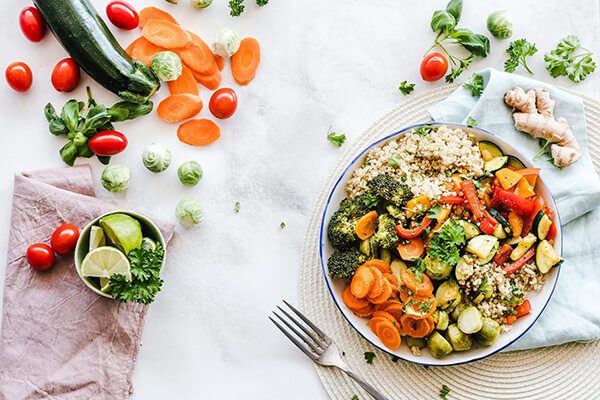 a bowl of vegetables on the table representing food waste topic